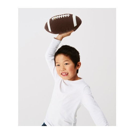 A children's toy resembling a brown American football, designed by IKEA.