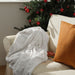 IKEA SPÖKSÄCKMAL Throw - White throw blanket with luxurious texture, draped over a sofa- 00566630