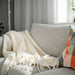 IKEA KLIPPOXEL throw blanket in a neutral off-white shade, measuring 130x170 cm (51x67 inches). A soft, textured blanket perfect for draping over a couch or using as an extra layer on a bed50584622