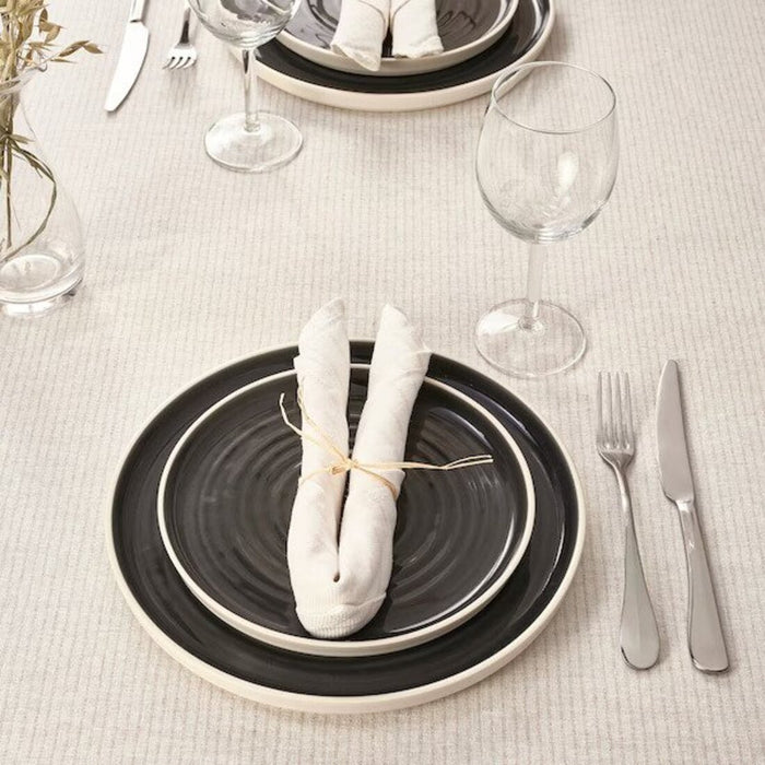 A table linen napkin in light beige/off-white stripes, measuring 35x35 cm