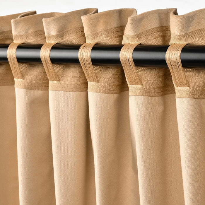 Close-up of SANELA beige curtains by IKEA, showing soft velvet texture and light-blocking fabric.
40561079