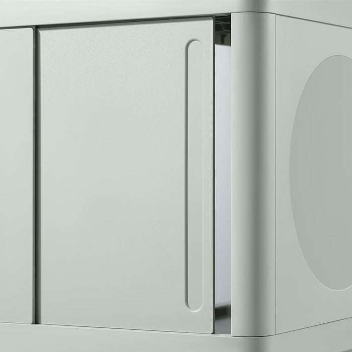 Close-up of the IKEA IVÖSJÖN wash-basin base cabinet, showcasing its sleek green finish and compact dimensions of 50x33x57 cm (19 5/8x13x22 1/2 inches). The sliding doors are emphasized, highlighting their smooth functionality, while the rounded edges add a touch of modern elegance. The image underlines the cabinet's practicality and stylish design, perfect for small bathroom spaces needing an efficient storage solution-00597293   