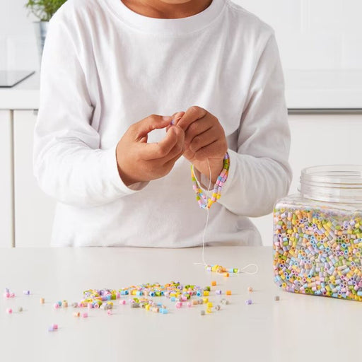 Kid enjoying imaginative play with the IKEA children beads      60316073