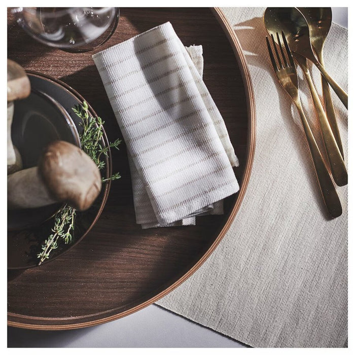 A table linen napkin in light beige/off-white stripes, measuring 35x35 cm