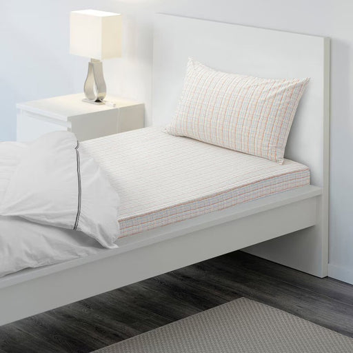 "Orange and blue checkered BEDYRA flat sheet and pillowcase by IKEA."