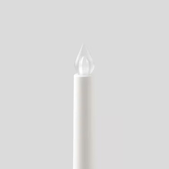 Battery-powered LED candle with a wax-like texture