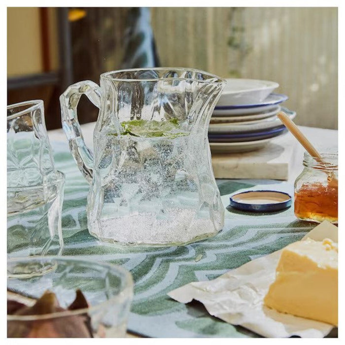 Refreshing lemonade served in a clear glass jug, perfect for outdoor gatherings and warm weather