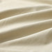 A close-up shot of IKEA's duvet cover in a soft light beige-green with a matching pillowcase -70490806