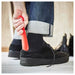 Man effortlessly using a shoehorn to put on his shoes  10530952