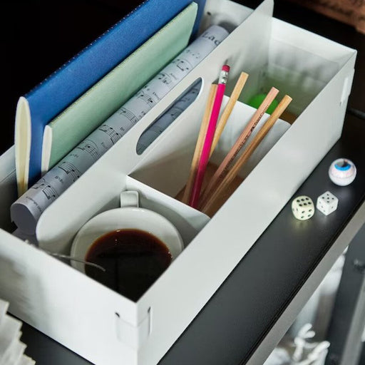A top view of an 18x36x14 cm white desk organizer by IKEA, offering an organized layout for various office supplies