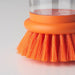 Close-up of the bright orange dishwashing brush with built-in dispenser from IKEA  30561023