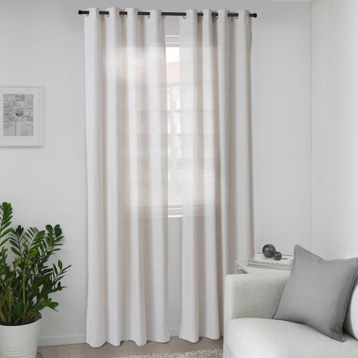 White and orange patterned IKEA curtains in a modern living room setting  00532305