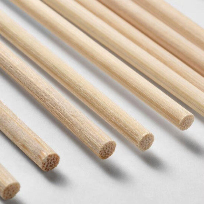 Set of wooden sticks on a light gray background