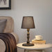 "Chic and practical, the KINNAHULT Table Lamp from IKEA enhances your room with soft lighting.-30488424