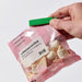 Close-up of a mixed-colour Sealing Clip in use, sealing a bag - Set of 26, IKEA  50524176