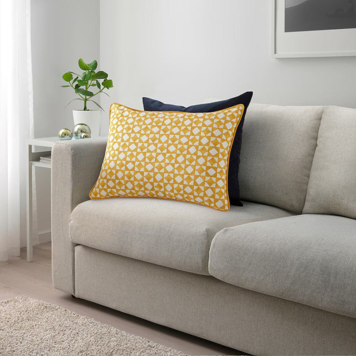 Bright yellow and white IKEA GOKVÄLLÅ pillow cover on a gray sofa, 40x58 cm 40596121

