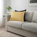 Bright yellow and white IKEA GOKVÄLLÅ pillow cover on a gray sofa, 40x58 cm 40596121

