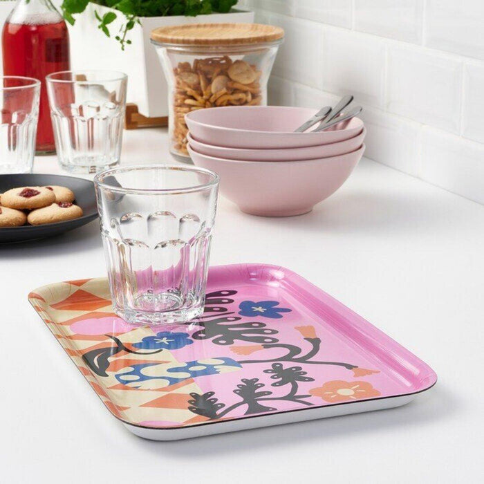 A decorative patterned/multicolour tray for organizing and serving with a touch of visual flair.