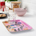 A decorative patterned/multicolour tray for organizing and serving with a touch of visual flair.