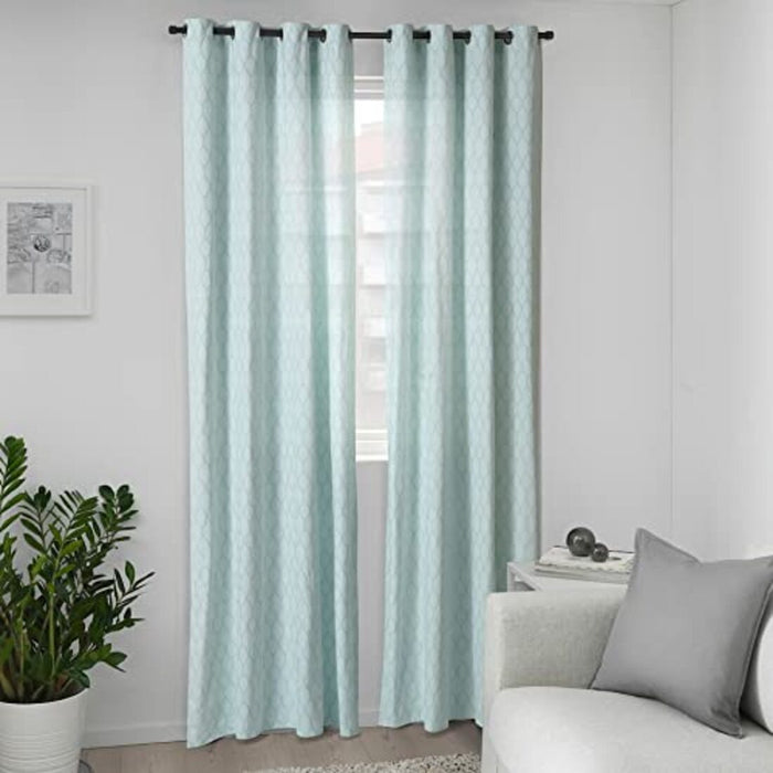 Pair of white and turquoise IKEA ADELHILD curtains hanging by a window 00532268