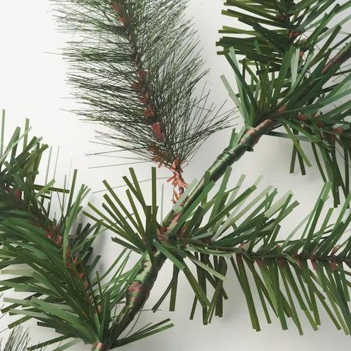 A detailed view of the realistic pine spruce texture on the garland.