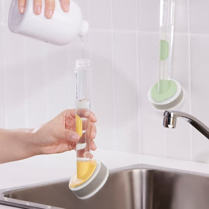 The dispenser from the IKEA dish sponge set being filled with dishwashing liquid for easy and controlled application