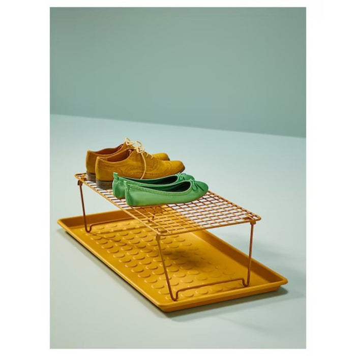 A practical shoe mat in dark yellow, color from IKEA, ideal for the entryway