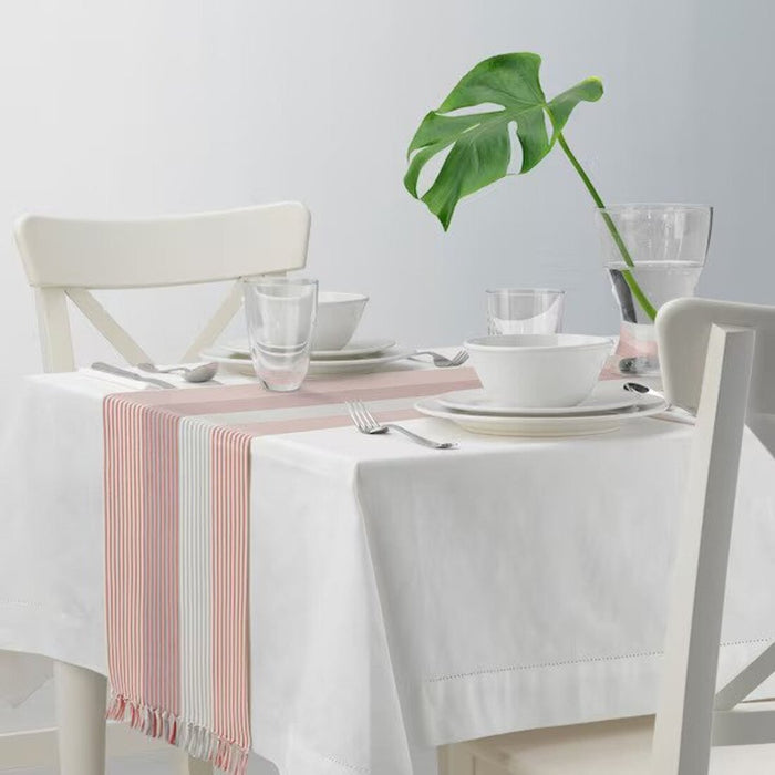 A minimalist table runner that brings a sense of calm and order to your dining area.50568783