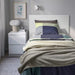 An image of IKEA TRATTVIVA Bedspread in Light Grey-Green (150x250 cm) on a Bed