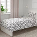 White and grey duvet cover and pillowcase set elegantly draped over a bed - 150x200 cm, IKEA  40466426