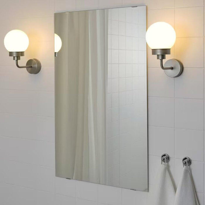 Industrial-style IKEA table lamp with a metal shade and base, adding a touch of edgy and modern flair to a workspace