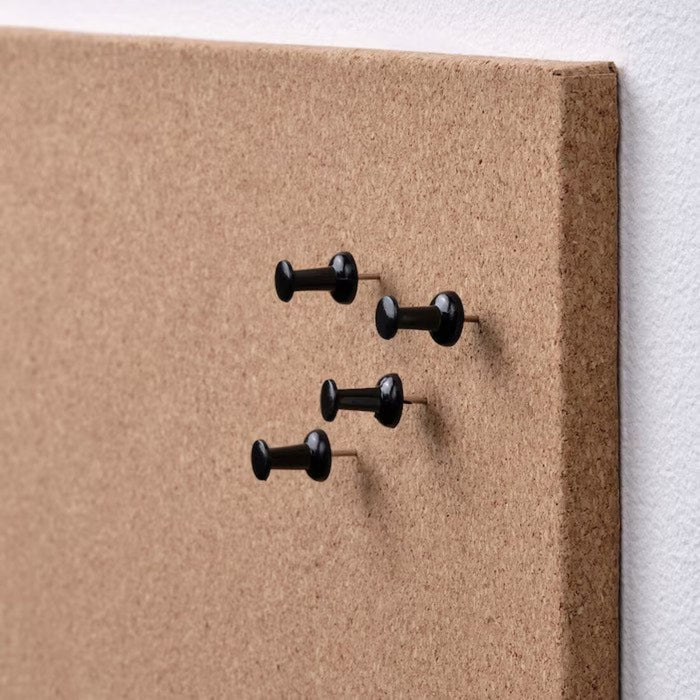 A close-up shot of an IKEA memo board showcasing its pinning functionality