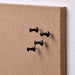 A close-up shot of an IKEA memo board showcasing its pinning functionality