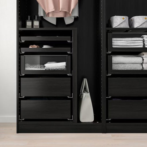 A contemporary glass-front drawer in black-brown finish from IKEA, ideal for organizing belongings.