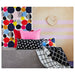  IKEA cushion covers in different colors and designs on a sofa