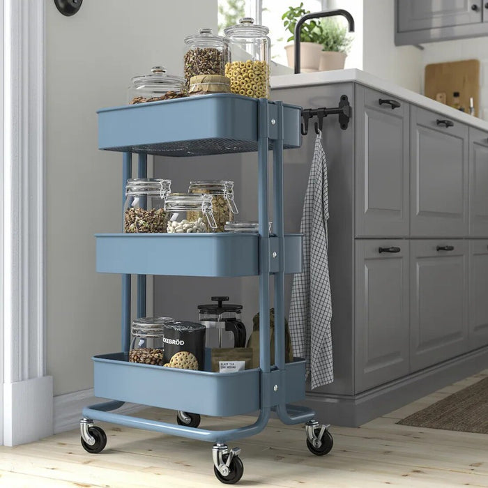 A grey-blue RÅSKOG trolley with durable steel construction, designed for use in kitchens, bathrooms, or workspaces, with dimensions 35x45x77 cm 40586787