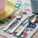 IKEA FABLER child-sized stainless steel cutlery set on colourful place mat suitable for ages 3 and above