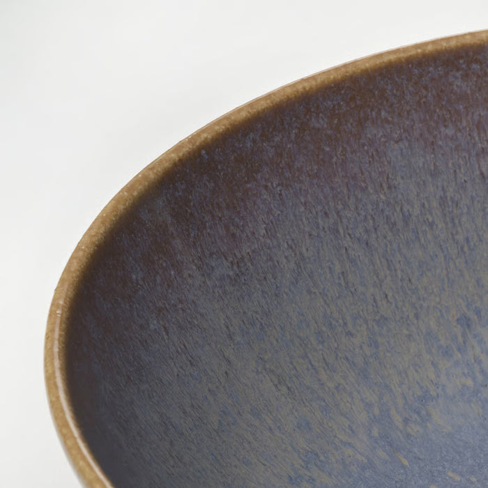 Close-up of IKEA FÄRGKLAR lilac stoneware bowl matt glaze texture