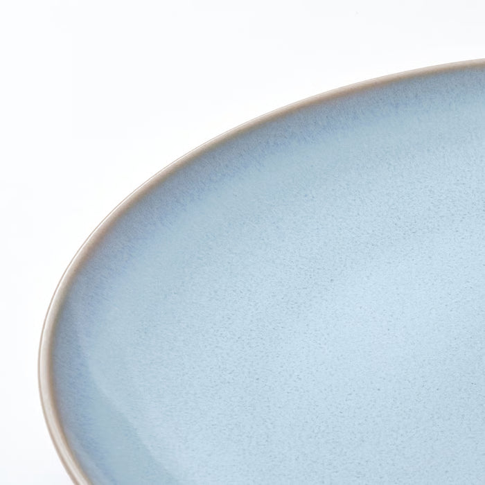 IKEA FÄRGKLAR light blue stoneware plate close-up on plain white background