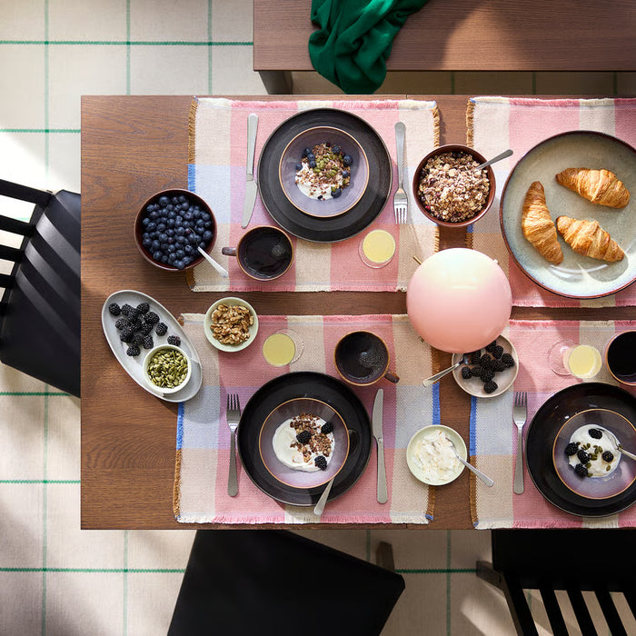 IKEA FÄRGKLAR lilac plates styled on dining table with matching bowls and cups