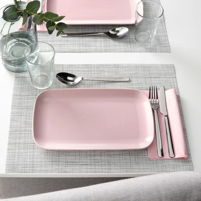 IKEA FÄRGKLAR platters placed on a dining table with a casual setup.