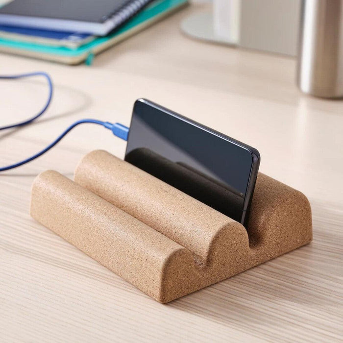 IKEA FAGNING cork holder for devices placed on a wooden table 00554142