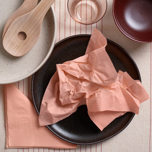 Vibrant orange-pink IKEA FANTASTISK paper napkins, 33x33 cm (13x13"), in a pack of 50, perfect for adding a pop of color to parties, dinners, and special occasions.