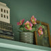 Close-up of IKEA FEJKA artificial Christmas rose pink flowers with natural detailing