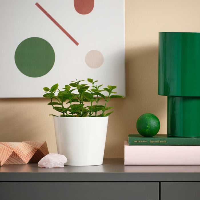 Scandinavian-style mint-green faux plant in a minimalist pot, adding freshness to any space without upkeep 20600869