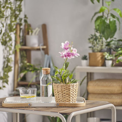 Pink faux orchid in a pot, part of IKEA’s FEJKA collection – a lifelike touch for tabletops or gardens.