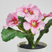 Close-up of IKEA FEJKA artificial primrose mixed colour flowers showing lifelike petal detailing