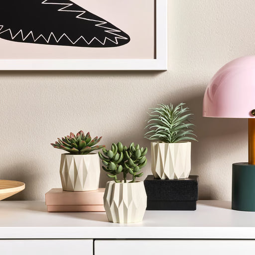 IKEA FEJKA artificial succulent trio clustered on a wooden shelf in a home setting