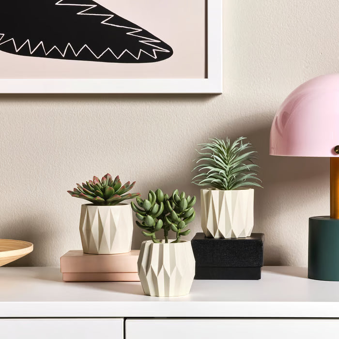 IKEA FEJKA artificial succulent trio clustered on a wooden shelf in a home setting