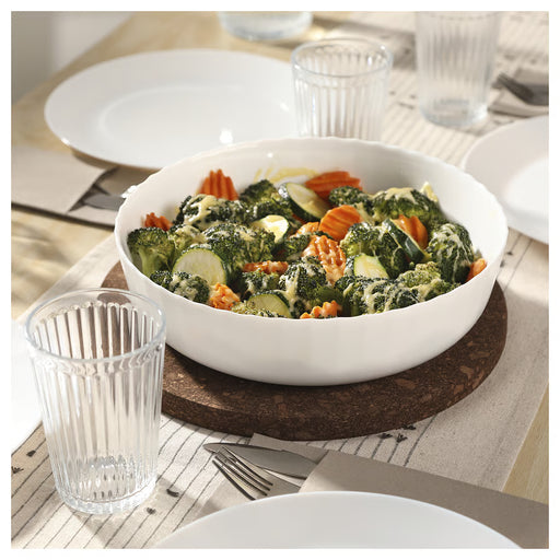IKEA FISKTÄRNA white oven dish filled with mixed vegetables on wooden dining table